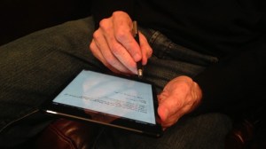 holding-his-ipad-mini