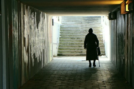 old woman in underpass